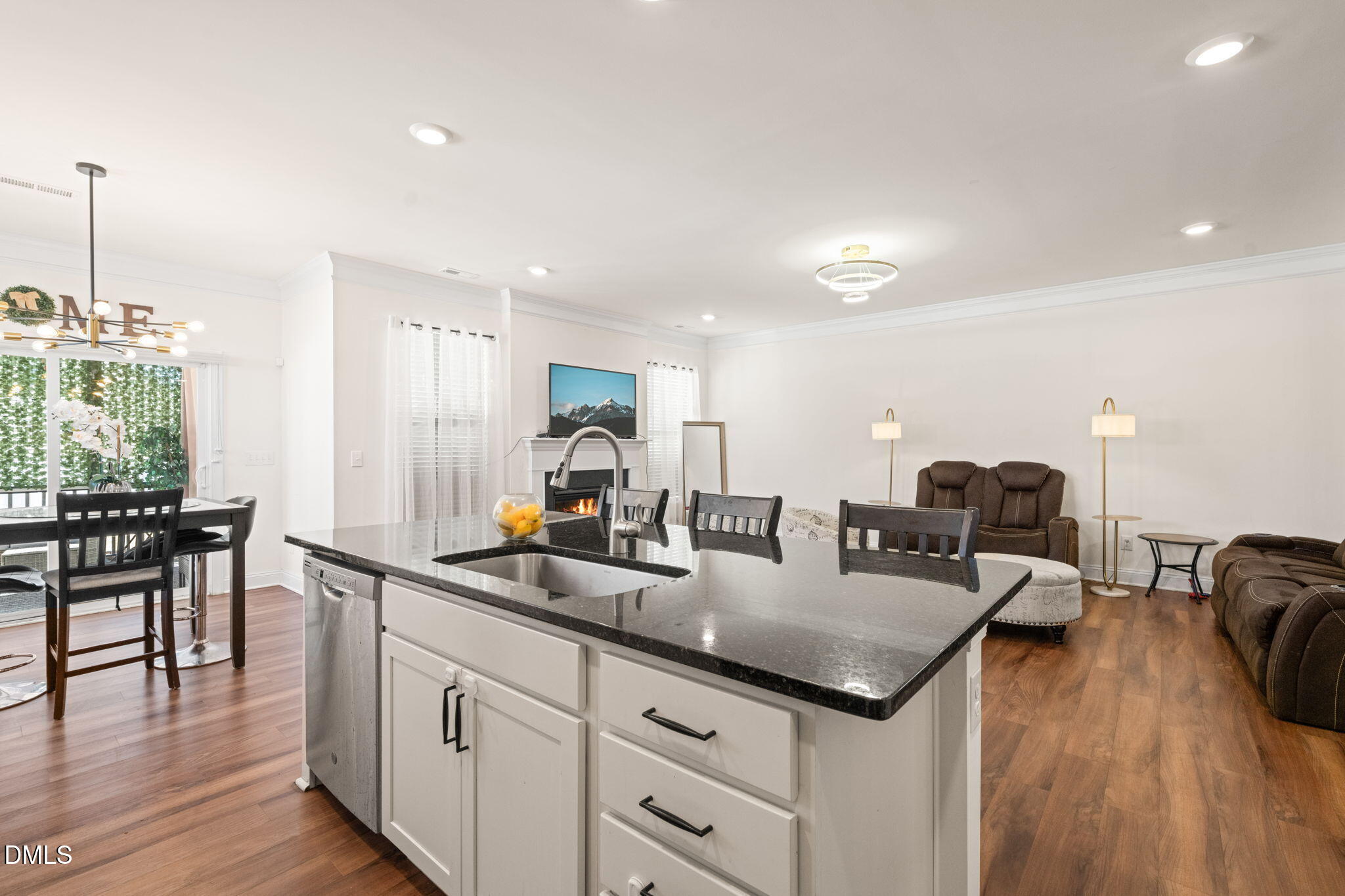 94 Combine Trail Benson, NC 27504 - Photo 6 of 43 a kitchen with stainless steel appliances granite countertop a sink a stove and a wooden floors
