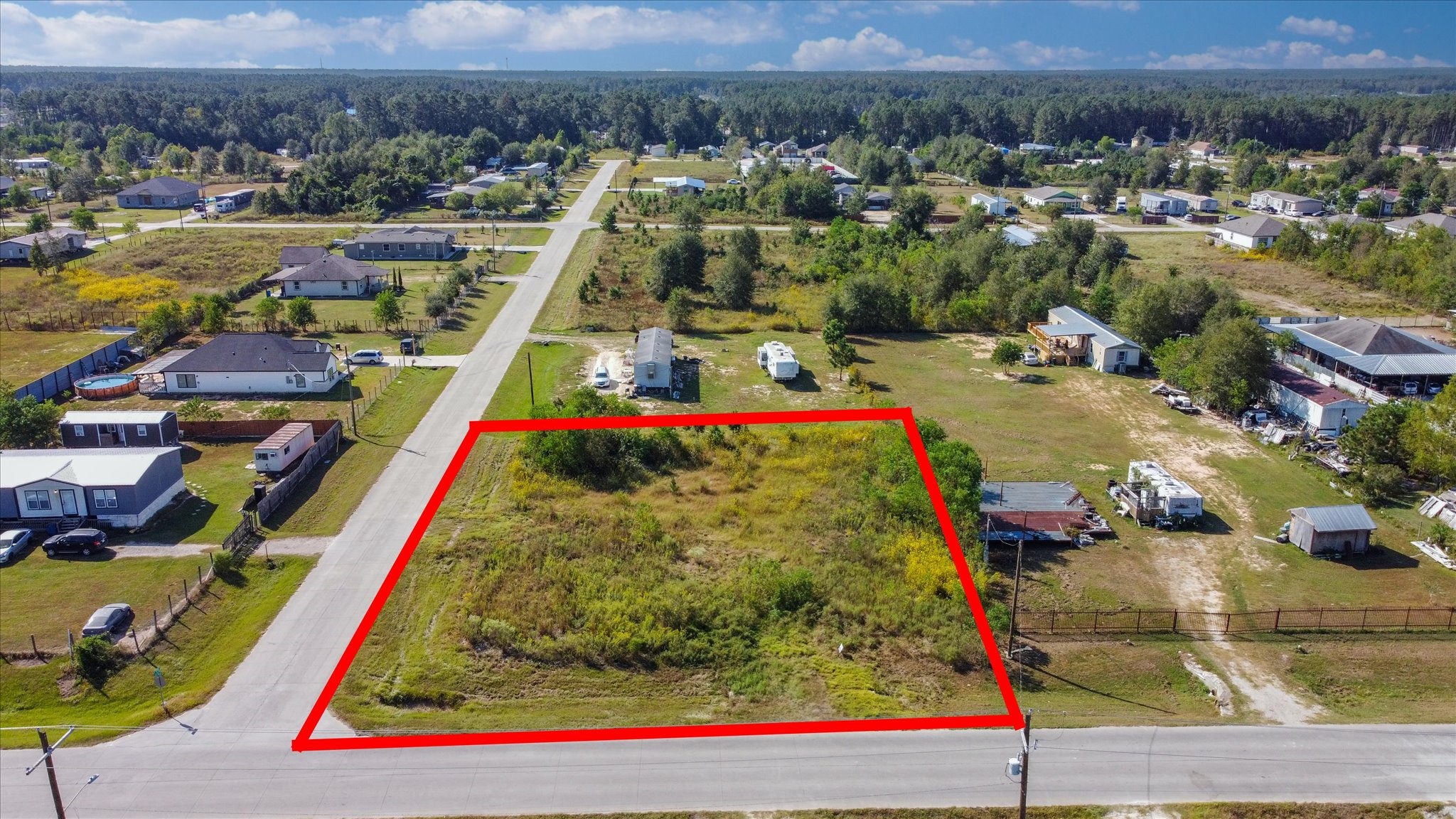 346 County Road 3550 Cleveland, TX 77327 - Photo 5 of 14 View of the residential homes nearby, demonstrating the friendly community atmosphere.