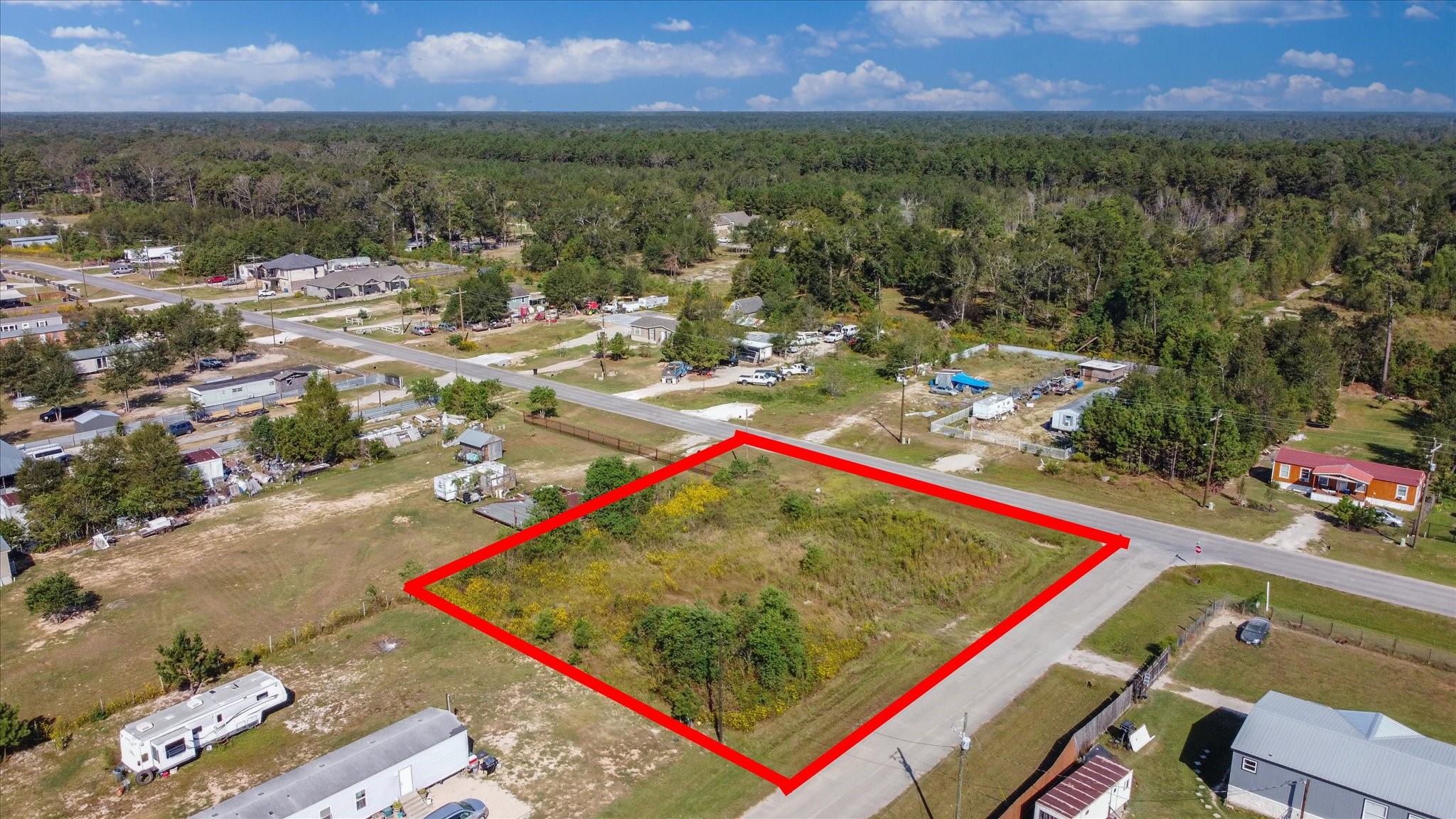 346 County Road 3550 Cleveland, TX 77327 - Photo 9 of 14 Scenic view of the lot, highlighting its tranquil setting and potential for residential use.