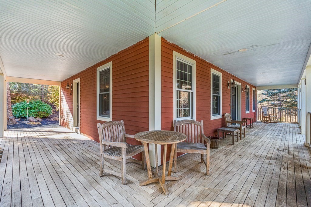 140 Forest Street Middleton, MA 01949 - Photo 23 of 32 a balcony with furniture and wooden floor