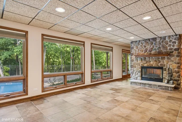 a dining room with furniture and a fireplace