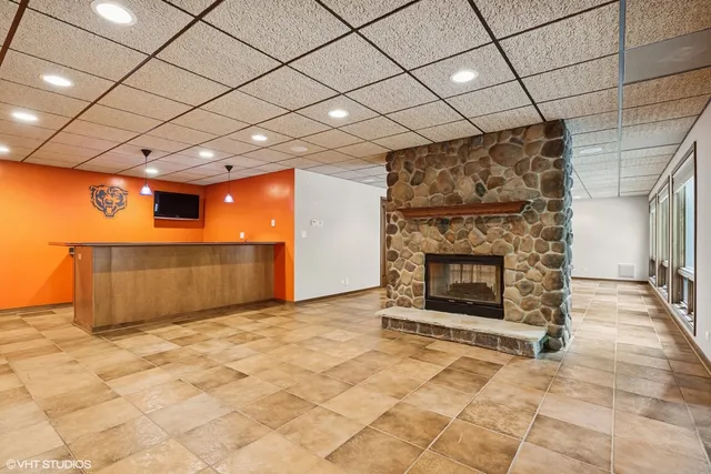 a kitchen with granite countertop a sink cabinets and window