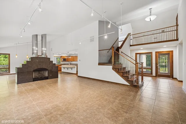 a kitchen with granite countertop a stove and a sink