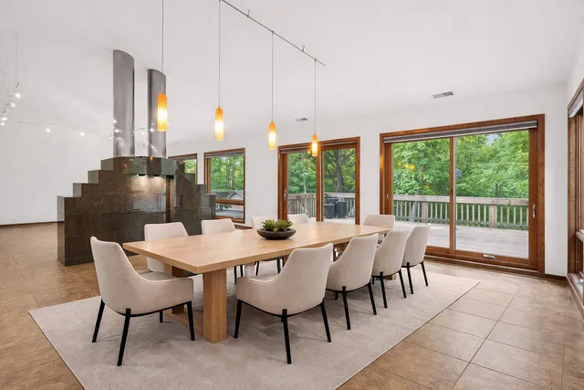 a bedroom with furniture and a large window