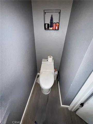 a bathroom with a toilet and a sink