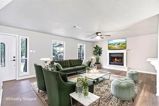 a living room with furniture and a fireplace