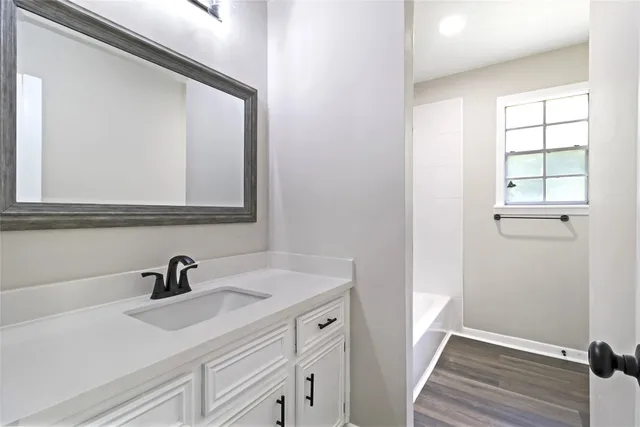 a bathroom with a sink and a mirror