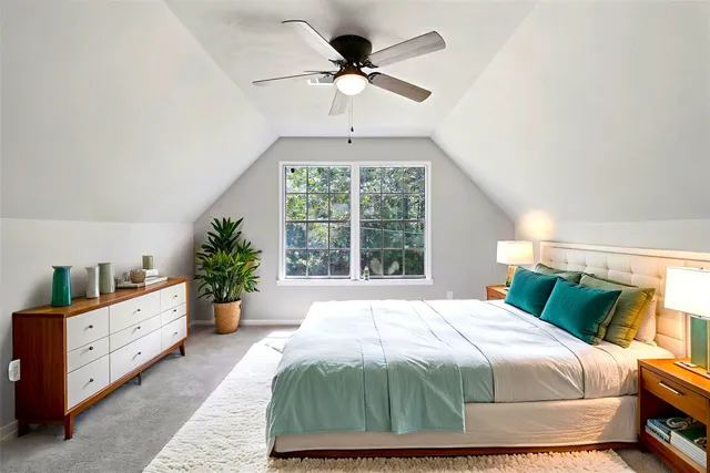 a bedroom with a bed and window