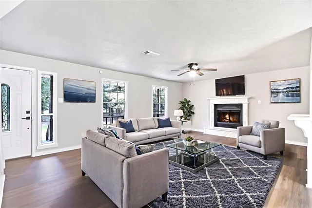 a living room with furniture and a fireplace