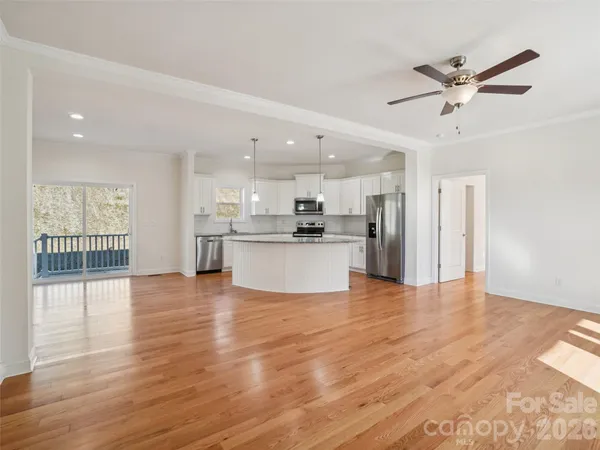 a view of kitchen with wooden floor and window
