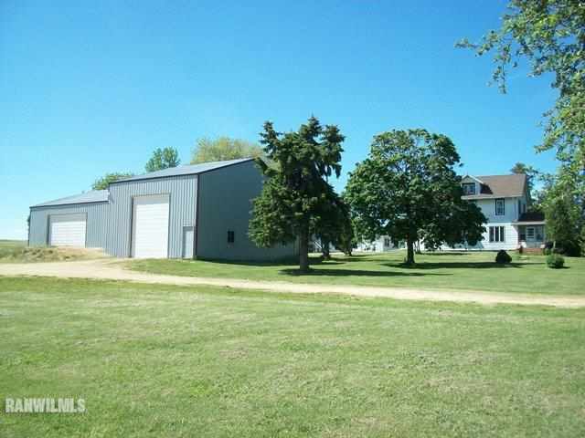 1754 North Henderson Road Freeport, IL 61032 - Photo 1 of 12 a front view of a house with a yard