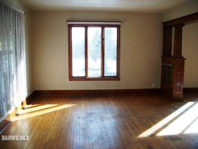 1754 North Henderson Road Freeport, IL 61032 - Photo 5 of 12 a view of an empty room and window