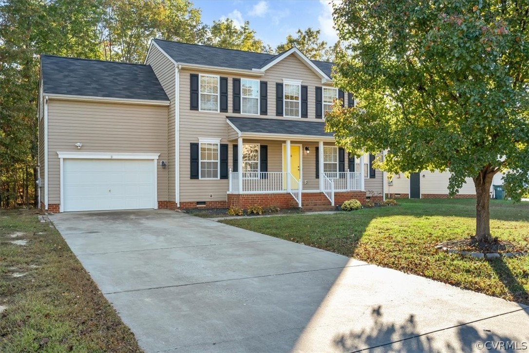 2931 Heather Ridge Drive Henrico, VA 23231 - Photo 2 of 30 a front view of a house with a yard and garage