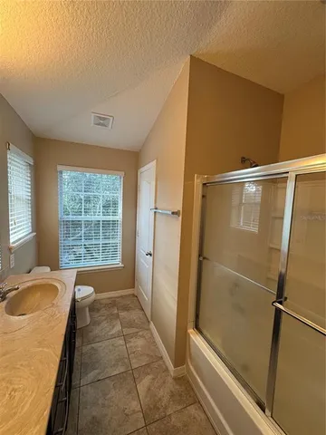 a spacious bathroom with a tub and shower