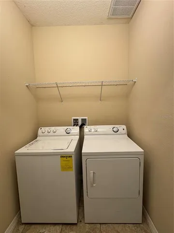 a room with window and a ceiling fan