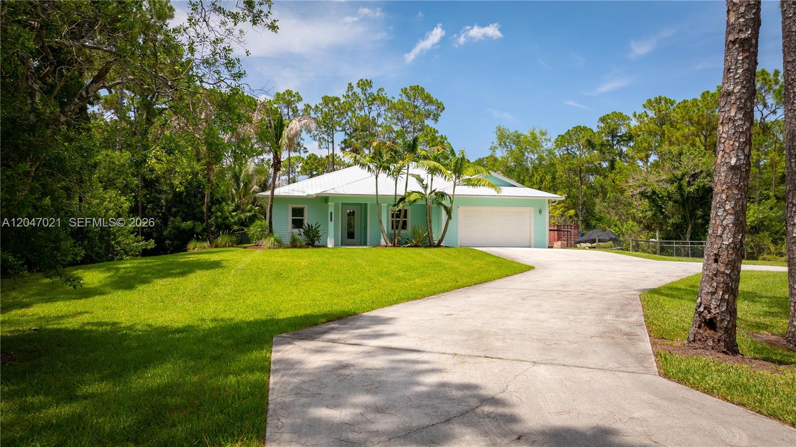 12127 154th Road North Jupiter, FL 33478 - Photo 60 of 67 paved driveway and street