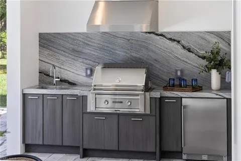 a kitchen with stainless steel appliances granite countertop a stove and a refrigerator