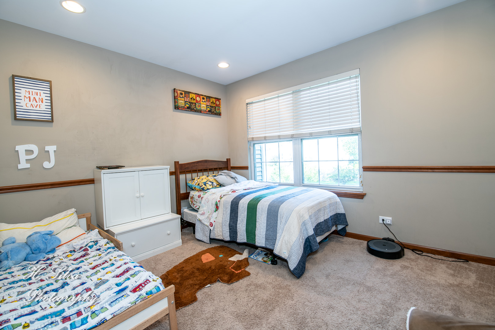 9530 Rainsford Drive Huntley, IL 60142 - Photo 10 of 14 a bedroom with a bed and a window