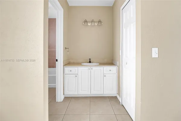 a bathroom with a toilet and bathtub