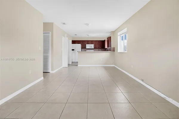 a view of a kitchen with a sink and a window