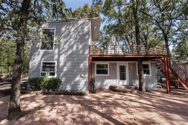a backyard of a house with yard and outdoor seating