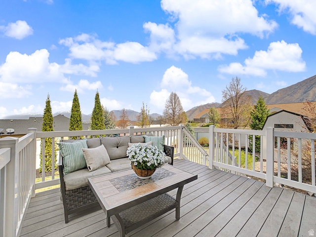 117 Ridge View Drive Elk Ridge, UT 84651 - Photo 10 of 42 Deck featuring an outdoor living space, a mountain view, a storage unit, and a residential view