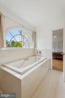 a bathroom with a bathtub and a sink