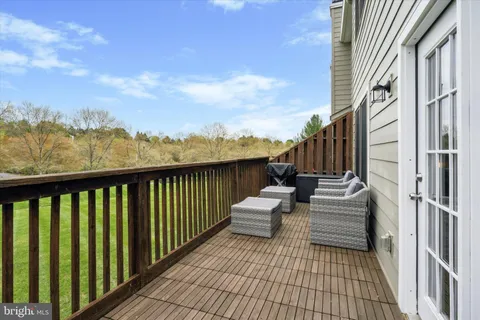 a view of balcony with furniture