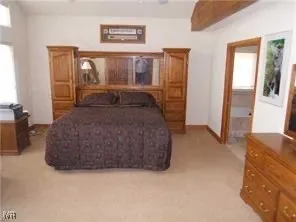 a living room with furniture a window and a fireplace