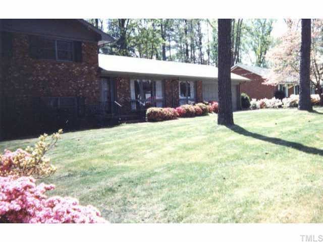 3413 Doyle Road Raleigh, NC 27607 - Photo 1 of 1 a view of a house with a yard and garage