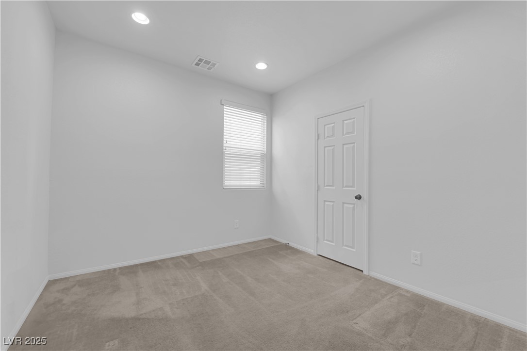 9205 Keystone Ridge Avenue Las Vegas, NV 89148 - Photo 13 of 40 Unfurnished room featuring carpet and recessed lighting