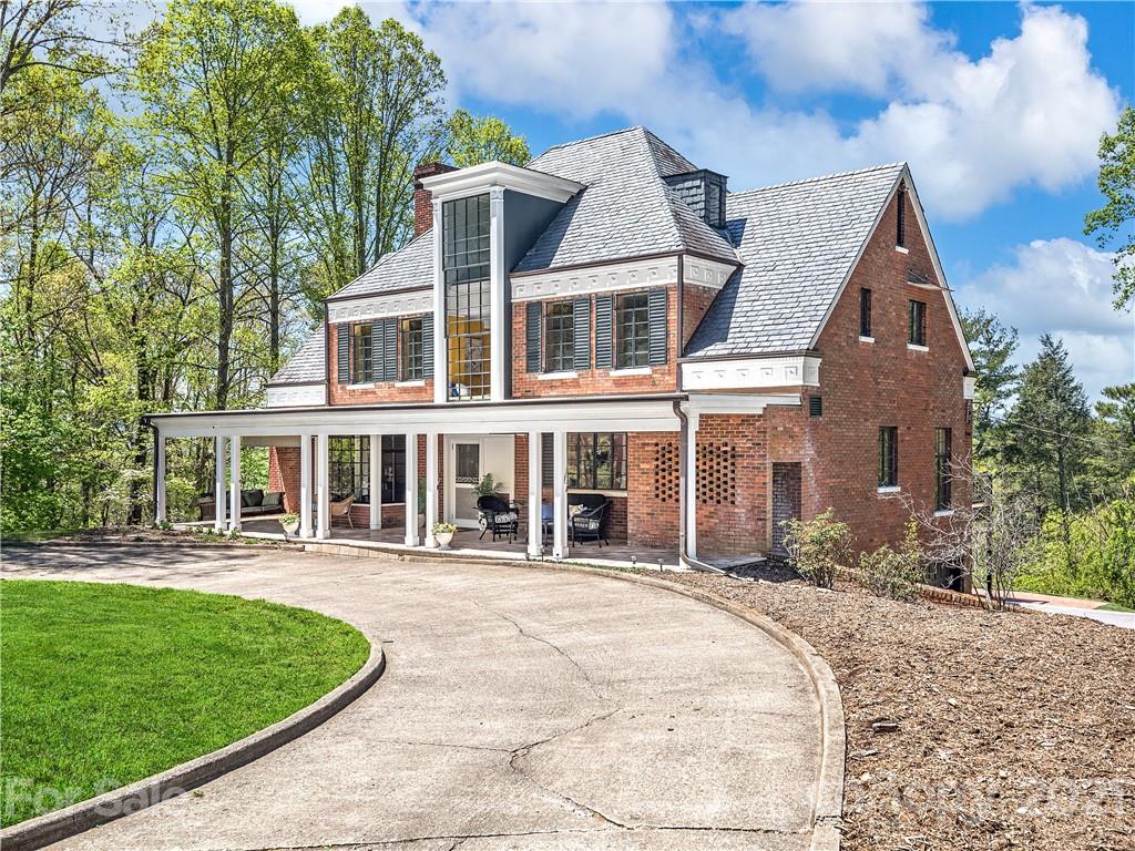 930 Country Club Road Asheville, NC 28804 - Photo 1 of 47 front view of a house with a yard