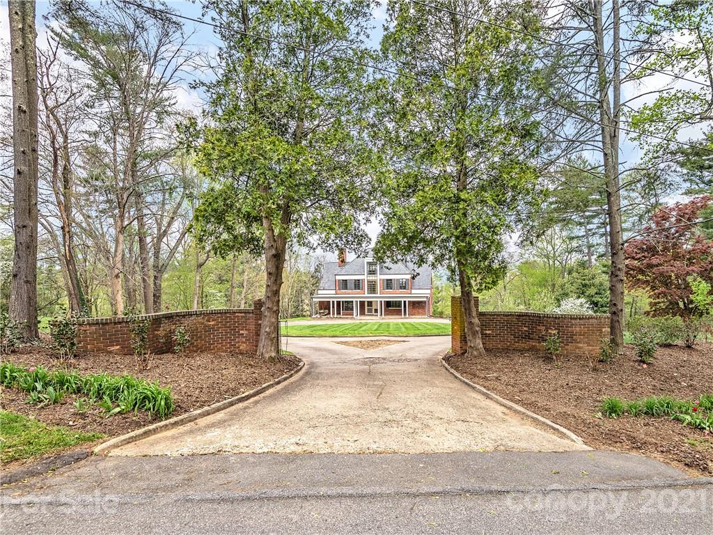 930 Country Club Road Asheville, NC 28804 - Photo 2 of 47 a view of a yard with large trees