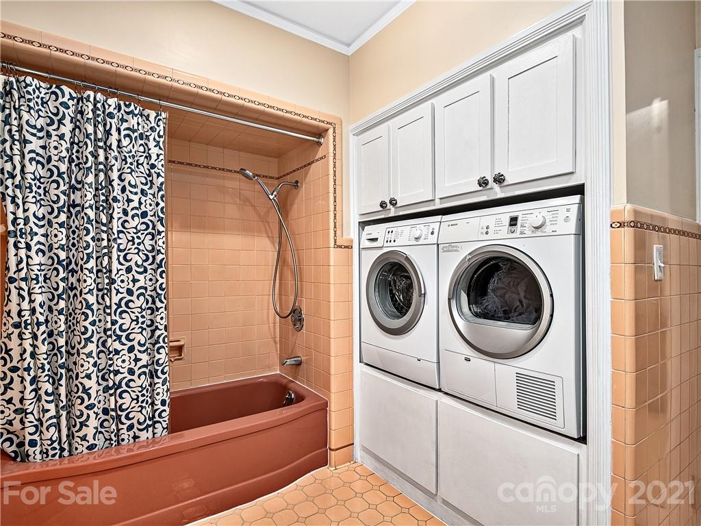 930 Country Club Road Asheville, NC 28804 - Photo 24 of 47 a bathroom with a bathtub and a shower