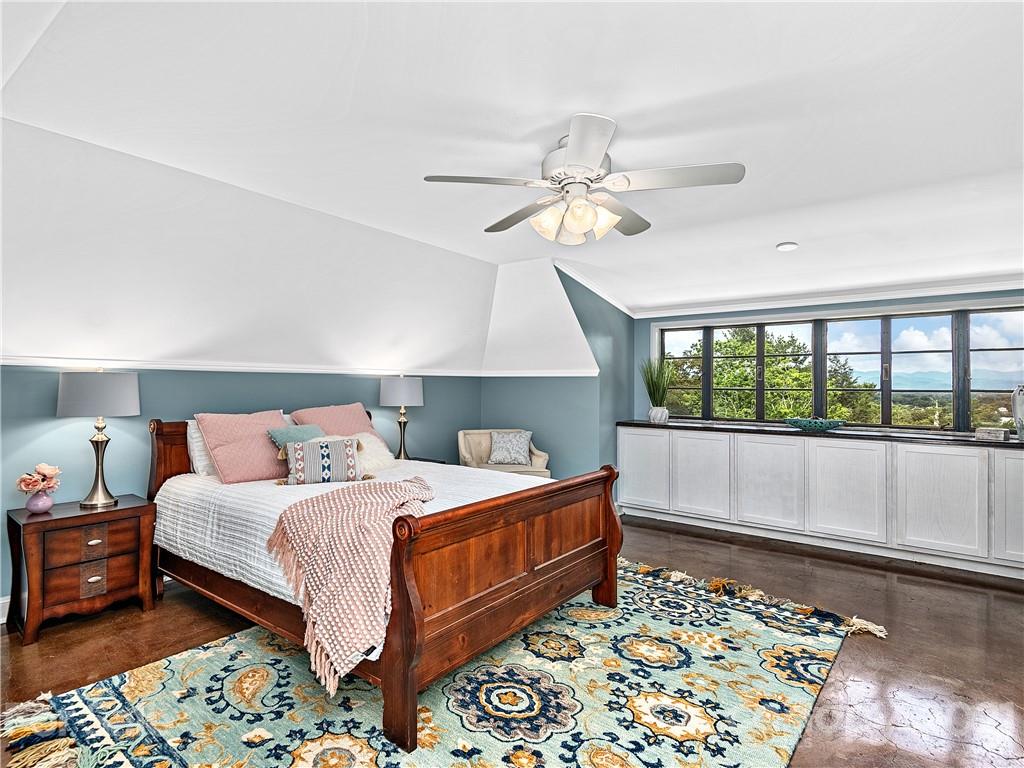 930 Country Club Road Asheville, NC 28804 - Photo 34 of 47 a bedroom with a large bed and a window