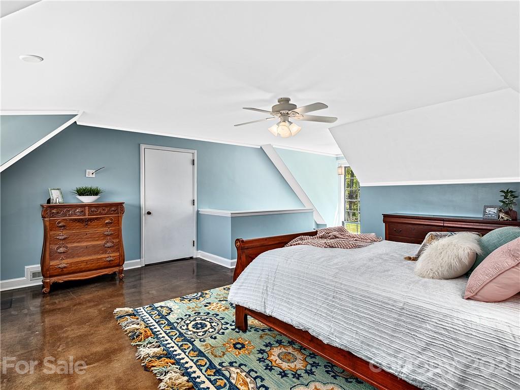 930 Country Club Road Asheville, NC 28804 - Photo 35 of 47 a bedroom with a bed and dresser