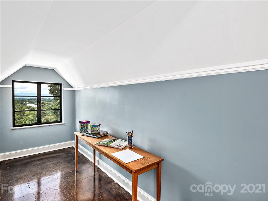 930 Country Club Road Asheville, NC 28804 - Photo 36 of 47 a room with a table and a window