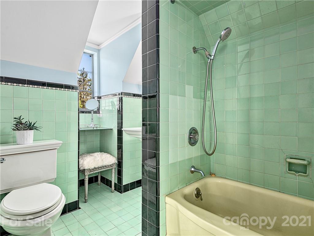 930 Country Club Road Asheville, NC 28804 - Photo 37 of 47 a bathroom with a toilet and a shower