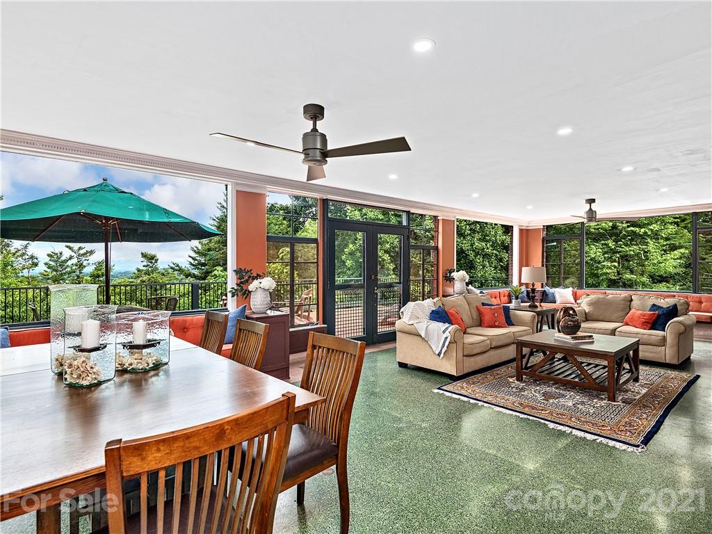 930 Country Club Road Asheville, NC 28804 - Photo 5 of 47 a living room with furniture and a large window
