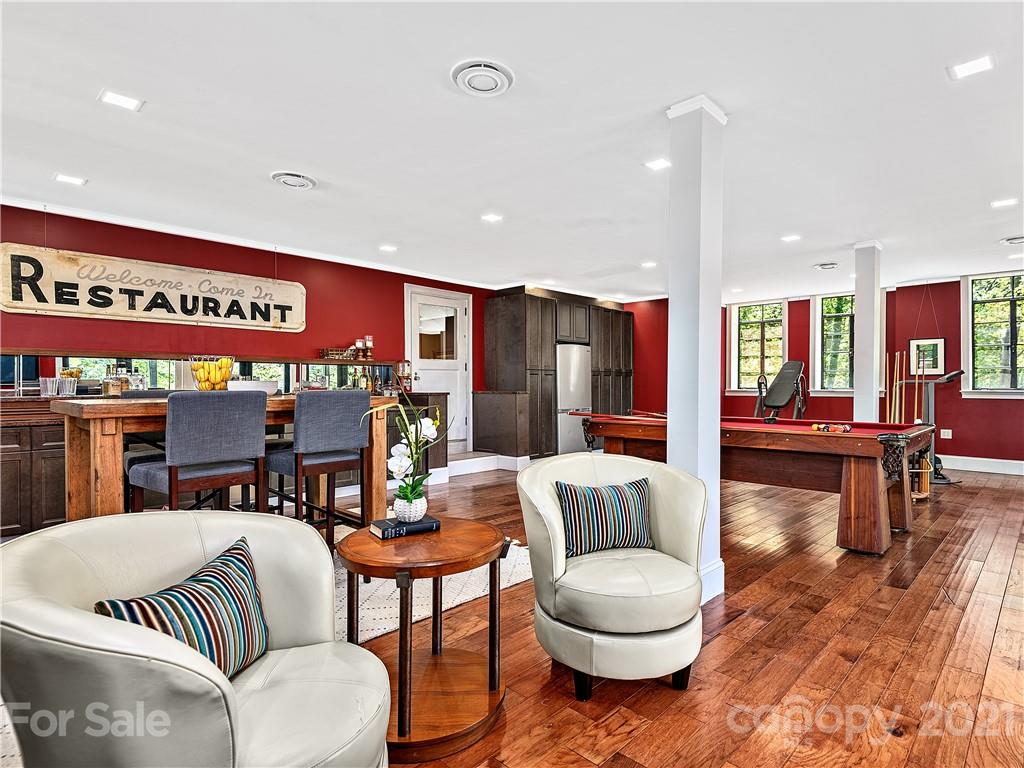 930 Country Club Road Asheville, NC 28804 - Photo 41 of 47 a living room with stainless steel appliances kitchen island granite countertop furniture and a large window