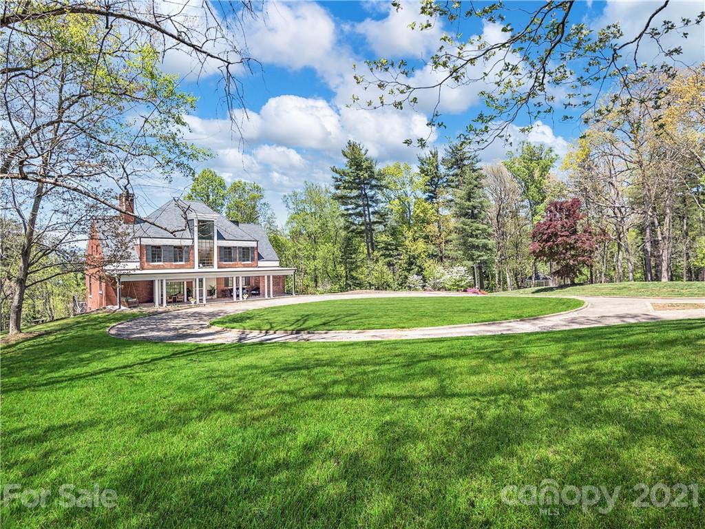 930 Country Club Road Asheville, NC 28804 - Photo 45 of 47 a view of a house with a yard