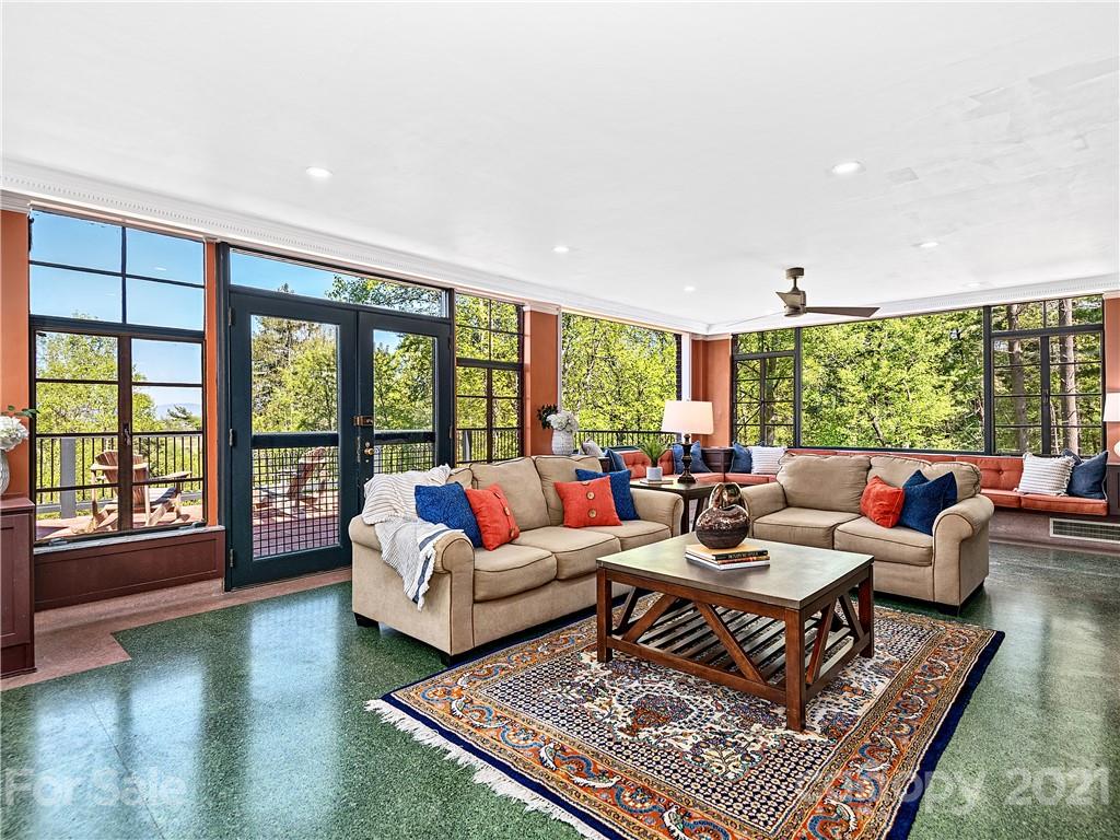 930 Country Club Road Asheville, NC 28804 - Photo 6 of 47 a living room with furniture and a large window