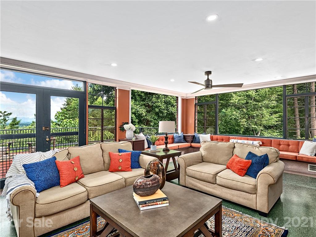 930 Country Club Road Asheville, NC 28804 - Photo 7 of 47 a living room with furniture and large windows