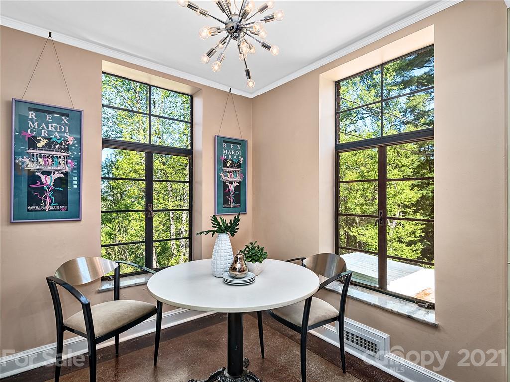 930 Country Club Road Asheville, NC 28804 - Photo 10 of 47 a view of a dining room with furniture window and outside view