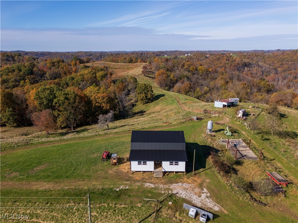 540 Wine Road Elizabeth, WV 26143 - Photo 38 of 49 Aerial overview of property's location featuring a heavily wooded area and rural landscape