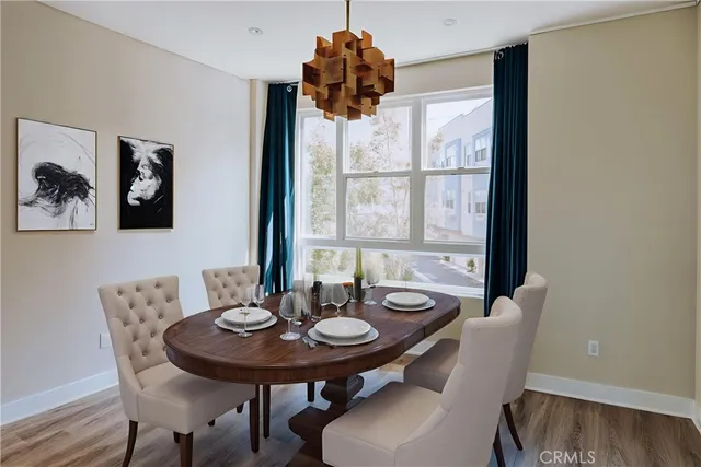 a view of a dining room with furniture and window