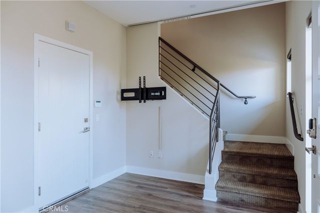 a view of entryway with wooden floor