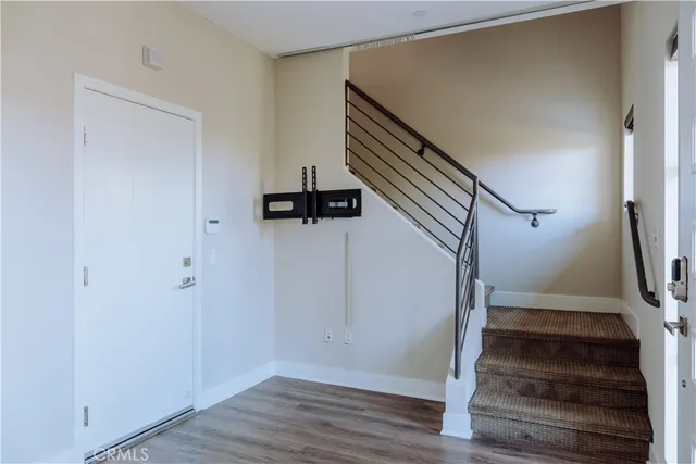 a view of entryway with wooden floor