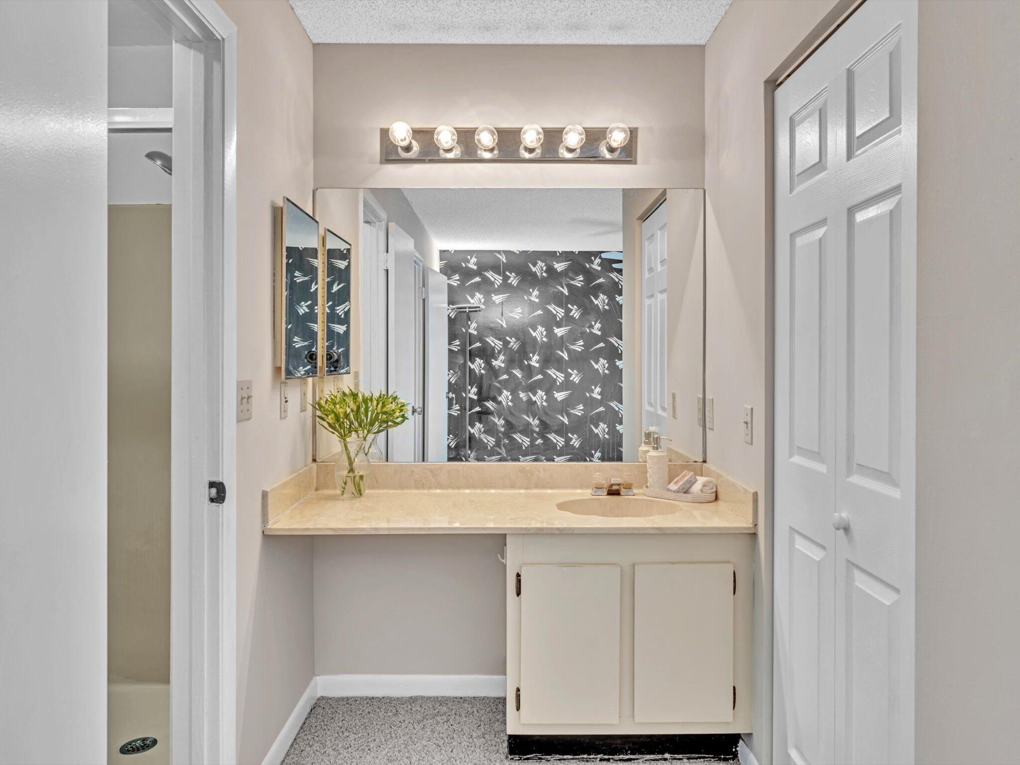 6318 Walk Circle Boca Raton, FL 33433 - Photo 20 of 43 a bathroom with a sink vanity and a mirror