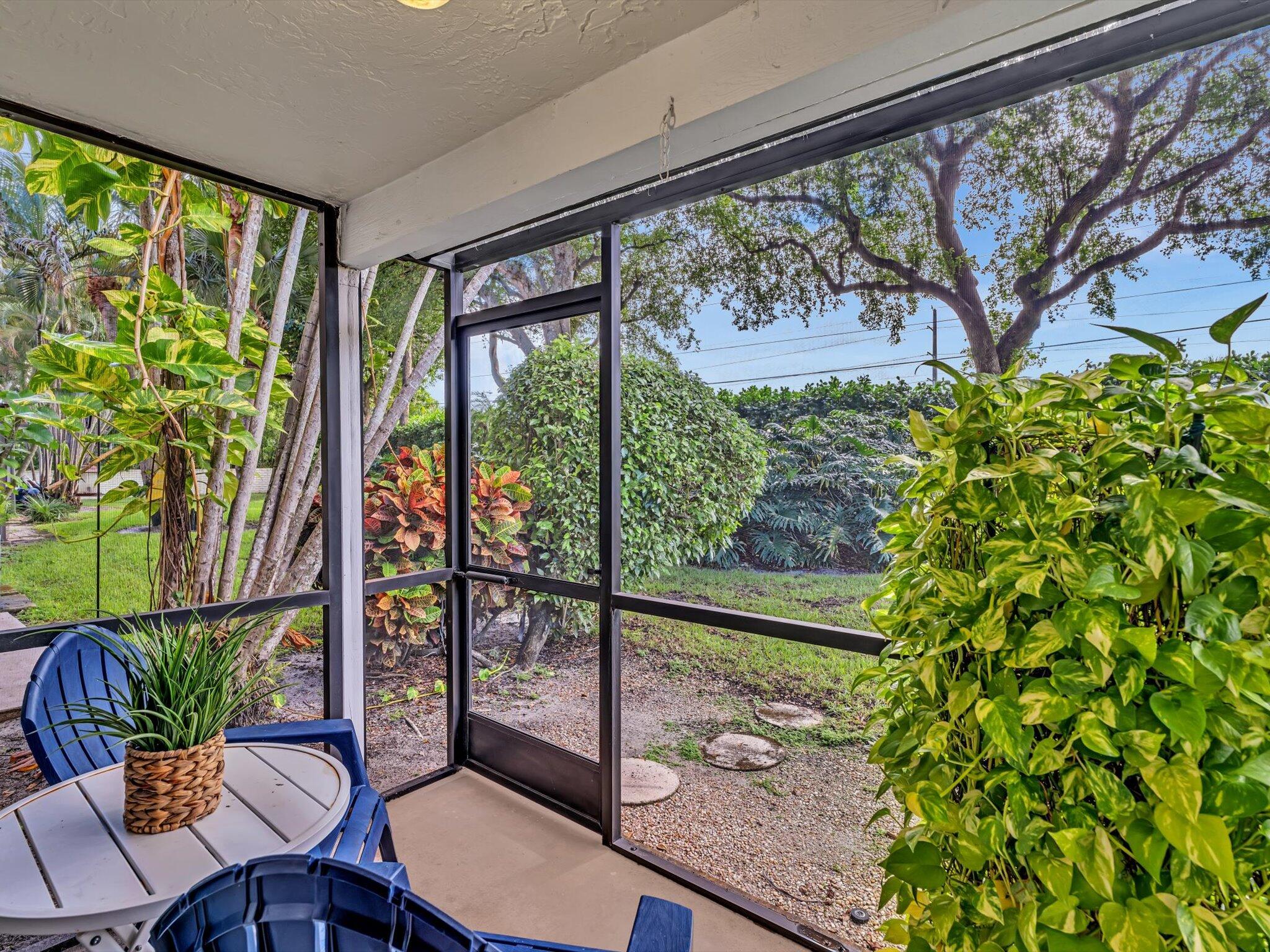 6318 Walk Circle Boca Raton, FL 33433 - Photo 31 of 43 a view of a porch with chairs and backyard